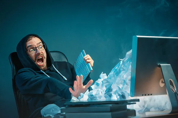 Person looking frustrated at unwanted emails - before learning to block someone on Gmail
